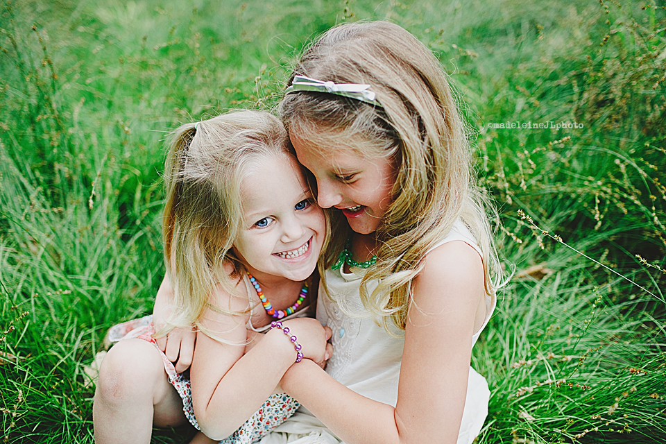 family photographer photography pictures session images sisters kids in grass park irvine orange county kids family session pictures photography photographer irvine california lake forest orange county